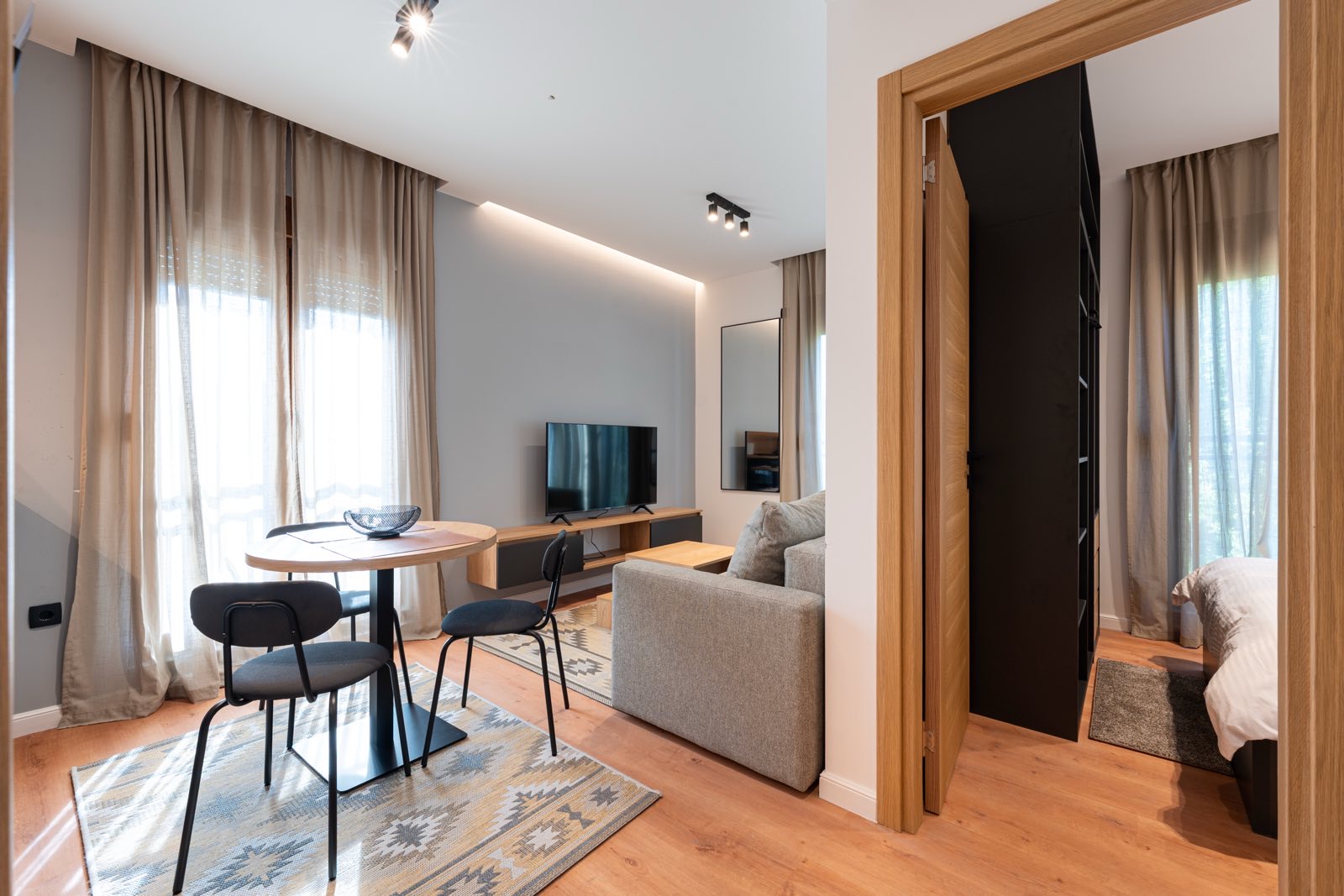 Open-plan living space leading to the bedroom