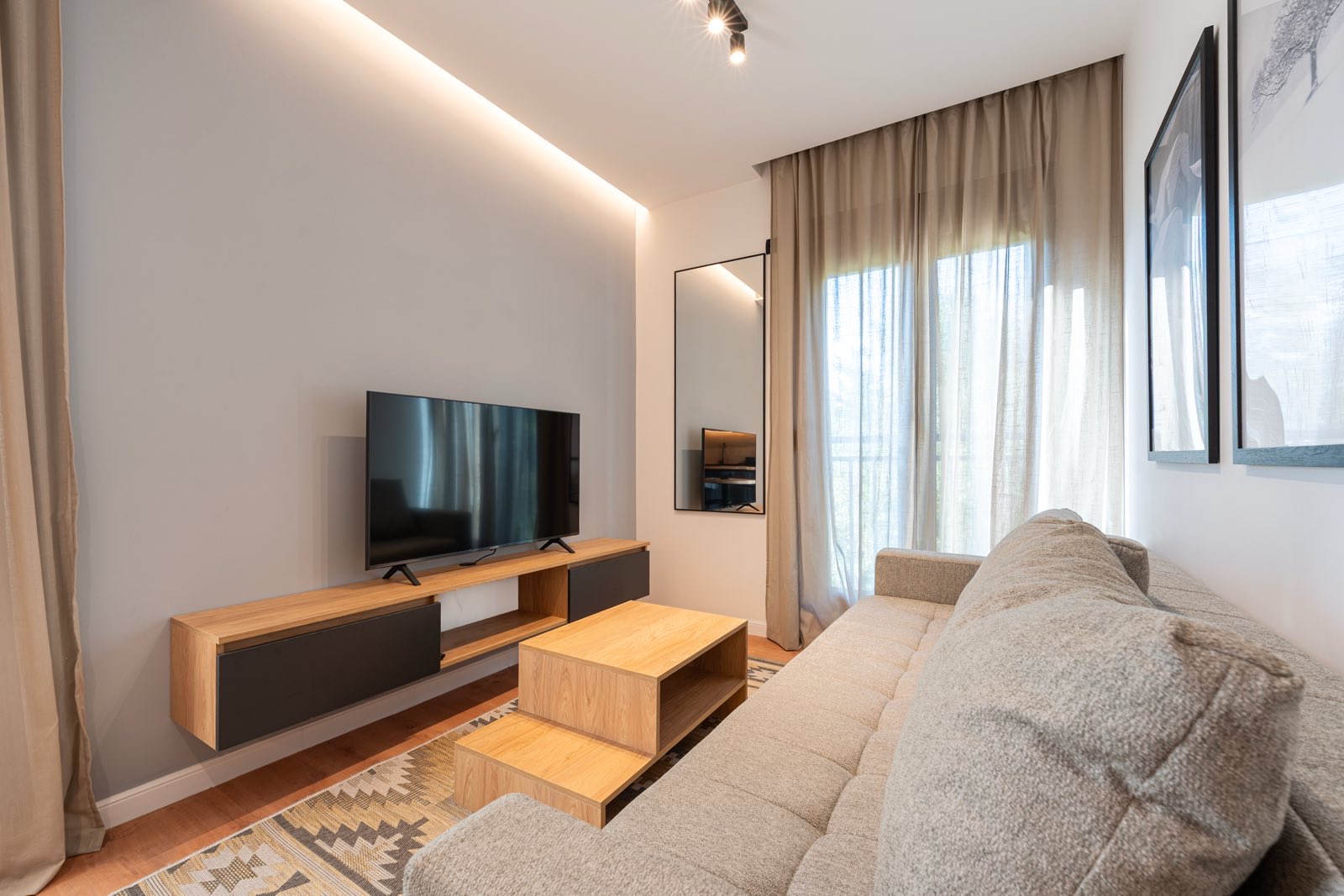 Lounge area with smart TV and coffee table